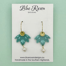 Load image into Gallery viewer, Pair of earrings on a Blue Raven Designs card with a light green background
