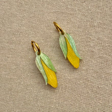 Load image into Gallery viewer, Two corn-shaped earrings on a textured beige fabric background

